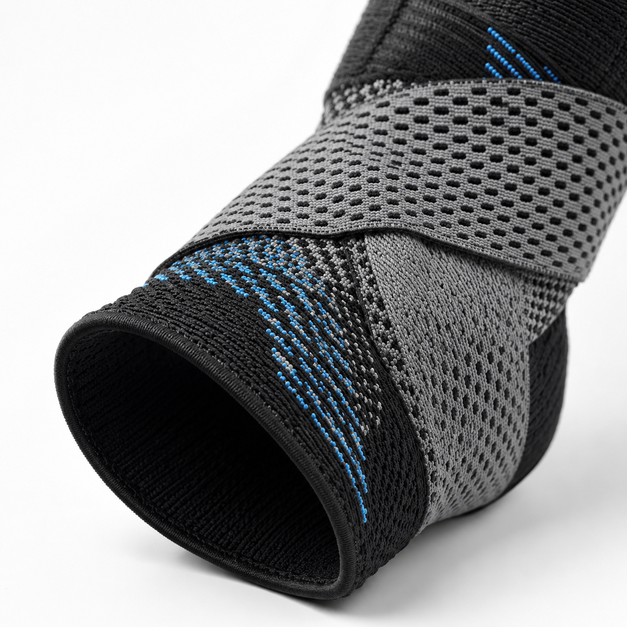 Adjustable ankle compression brace with breathable mesh support