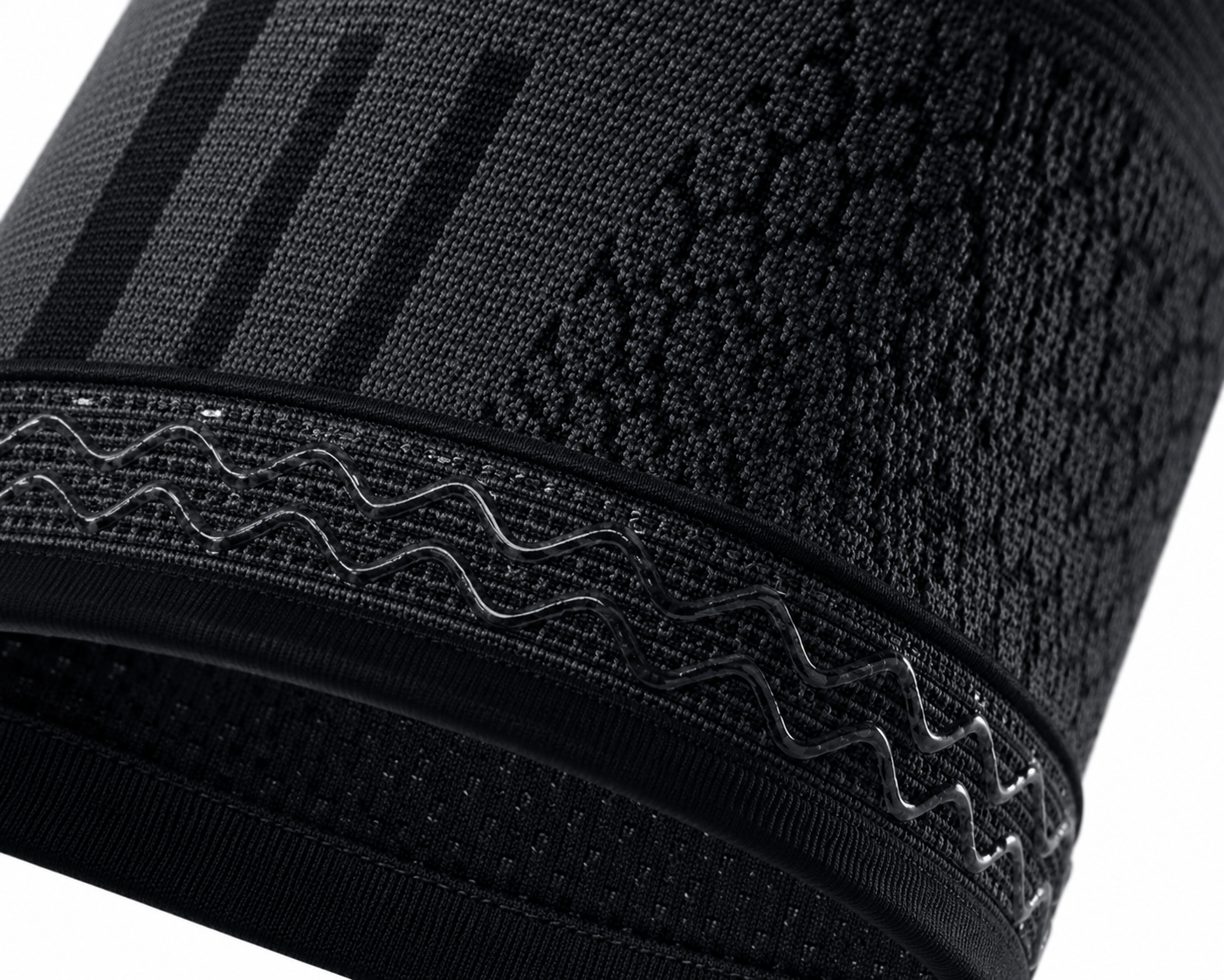 Close-up of compression knee sleeve textured fabric and anti-slip grip